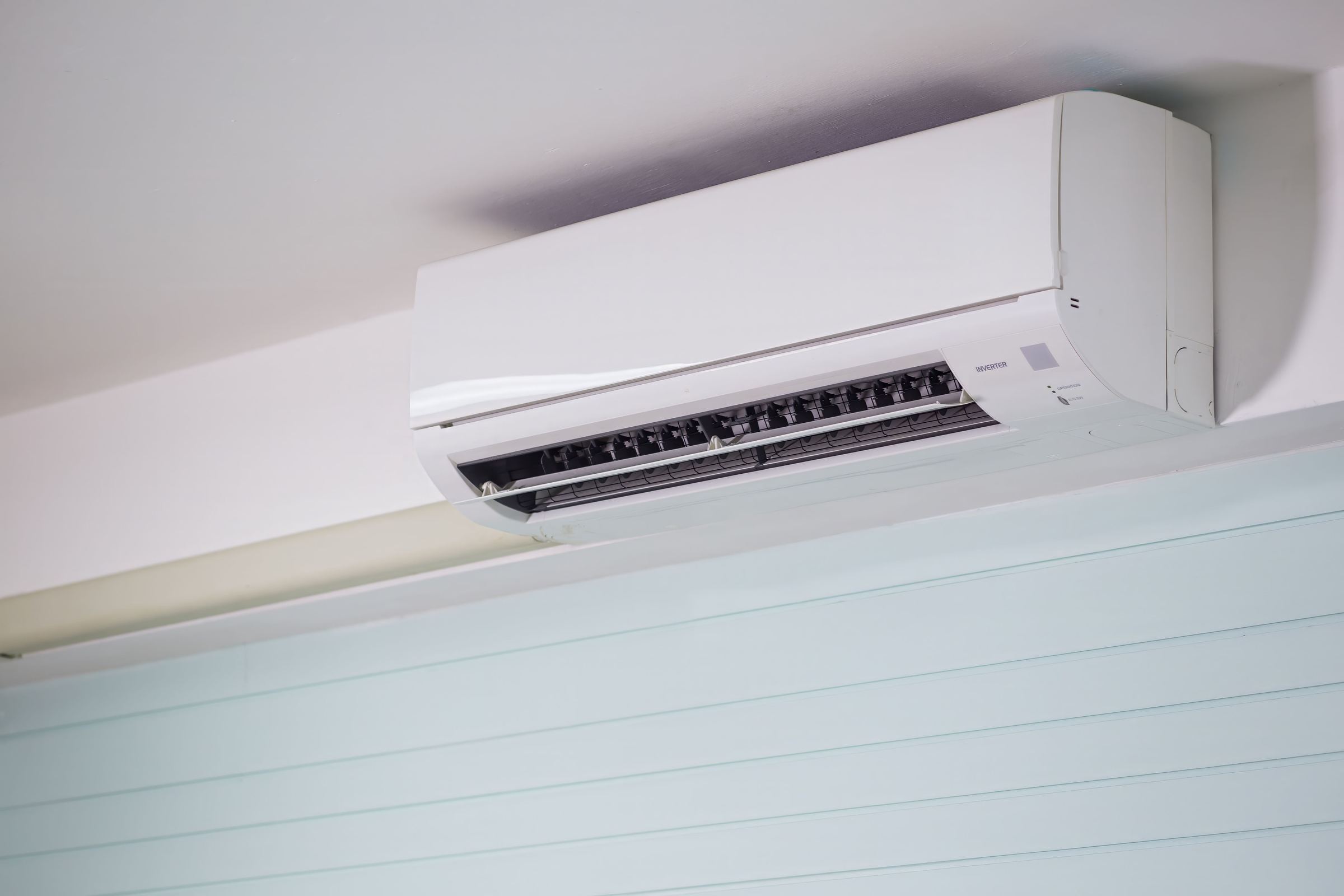 Wall-mounted heat pump in a light interior