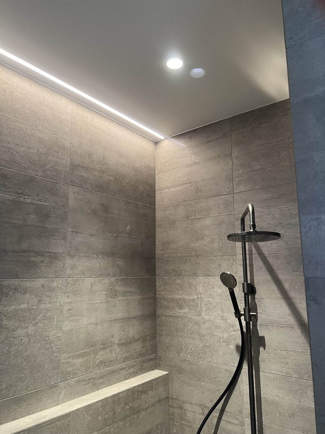 Two LED floodlights mounted on an outdoor wall
