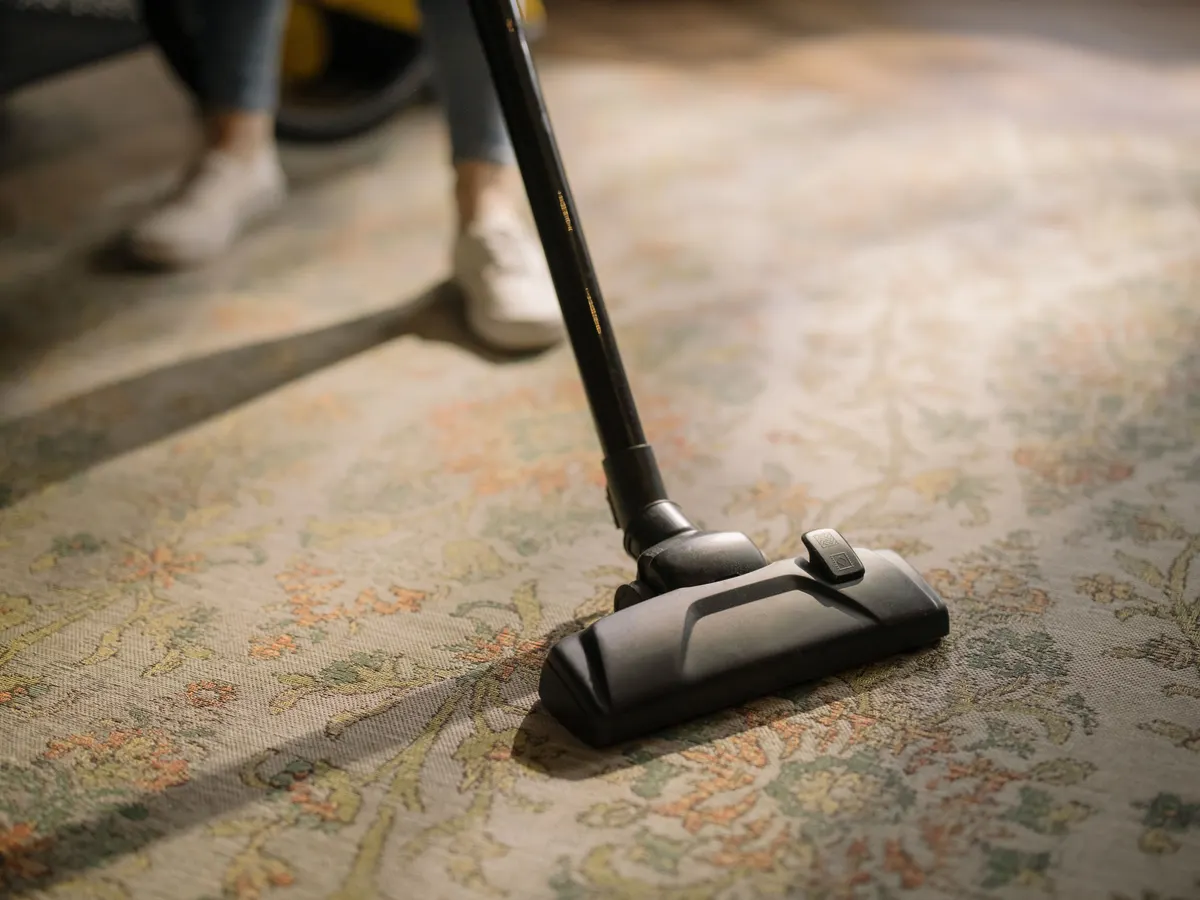 Vacuuming a patterned carpet.