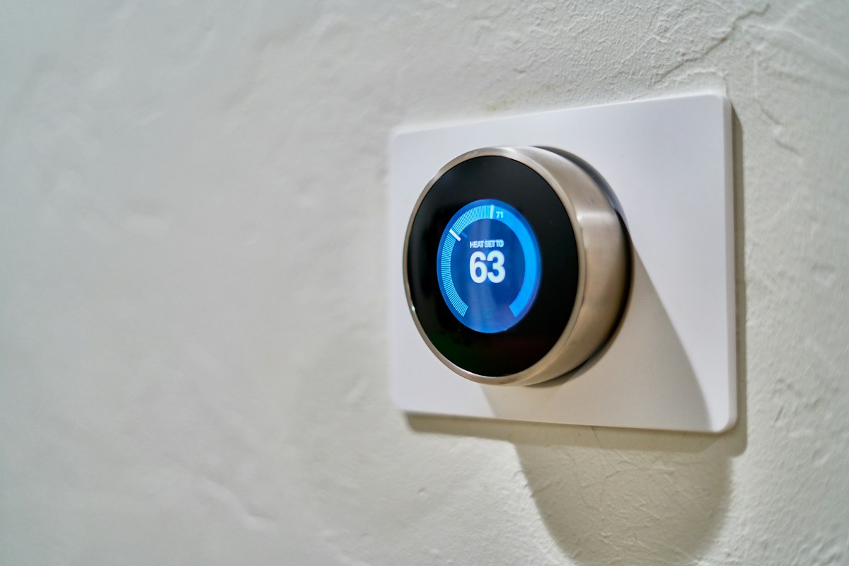 Smart thermostat on a wall