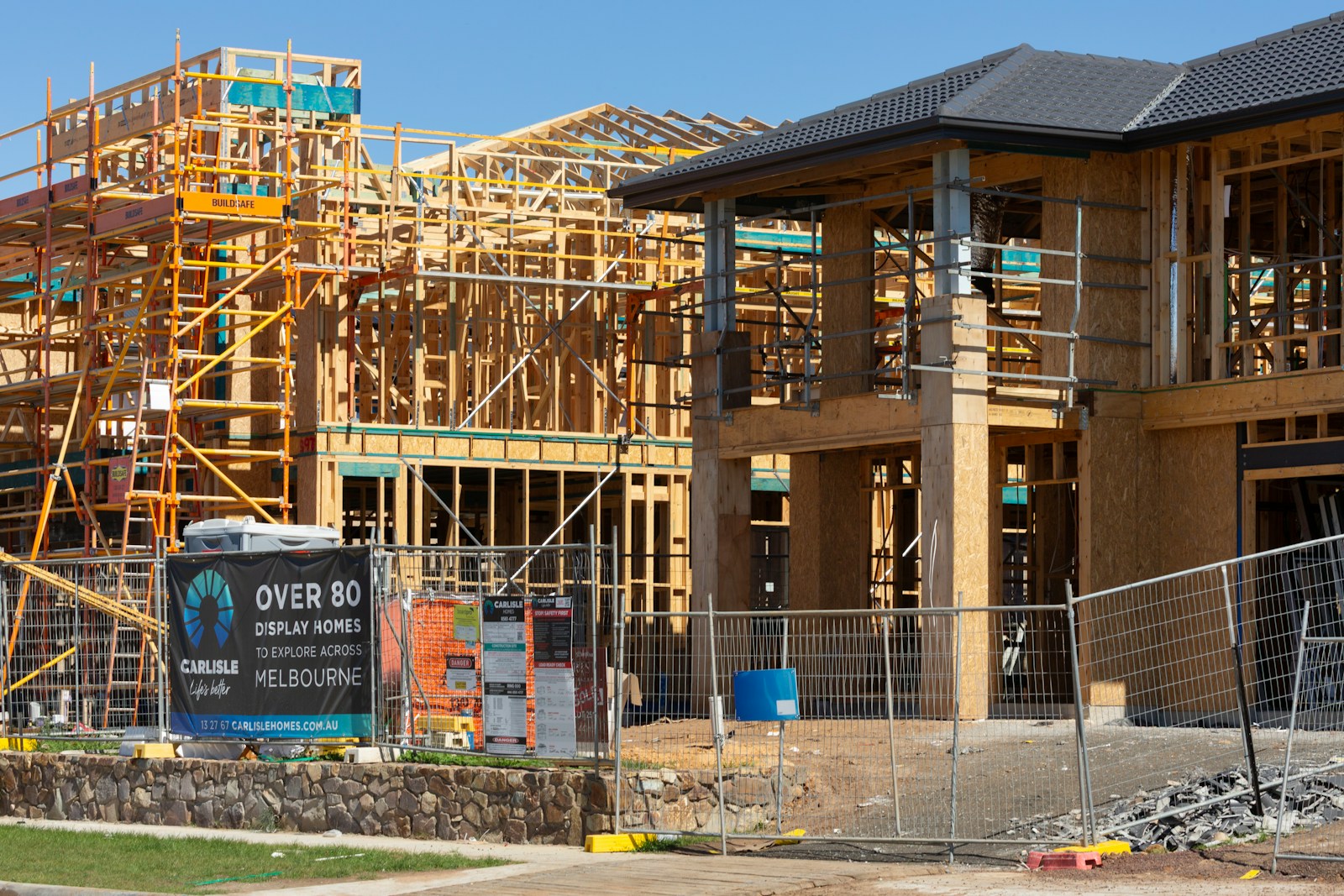New houses under construction with wooden framing