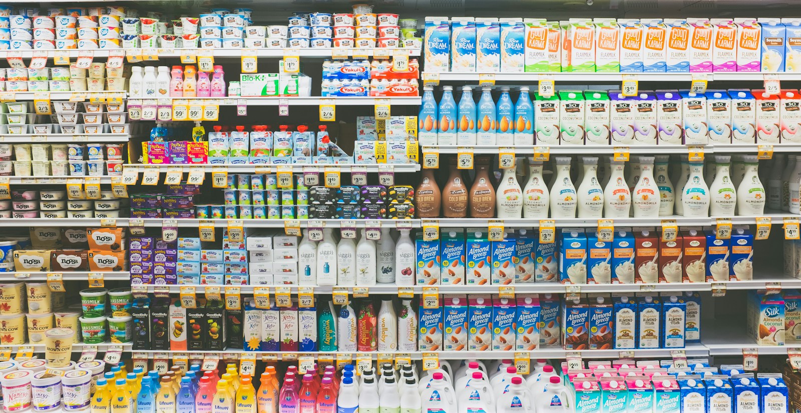 Assorted drinks in a white commercial refrigerator