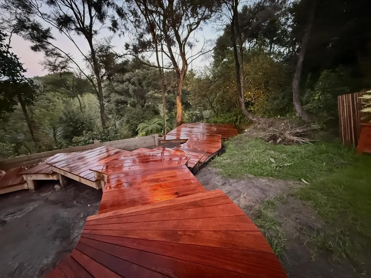 Scorpion Hardscapes Kwila timber walkway leading to a deck overlooking native bush