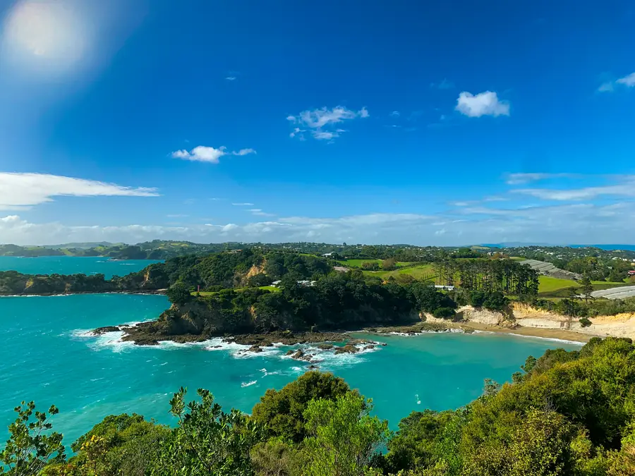 Turquoise bay and green headlands seen from a coastal lookout